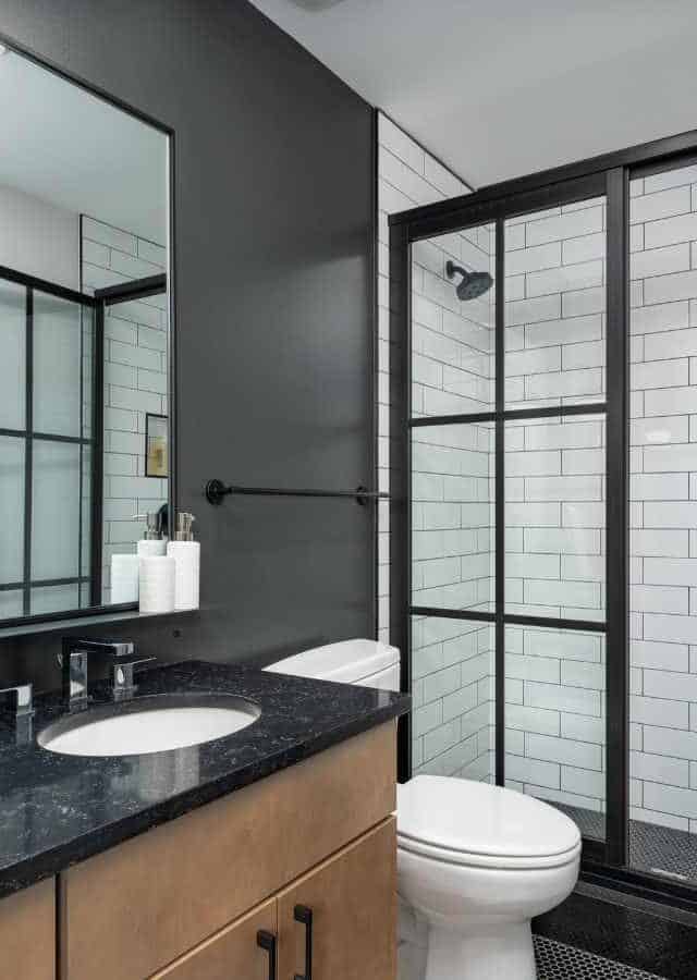 Bright, stylish bathroom with walk-in shower in Birmingham’s Mercantile on Morris.