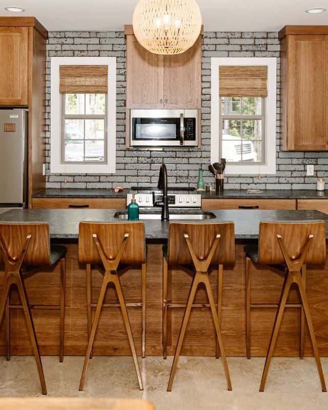 Bright, stylish kitchen featuring custom wood cabinets and a spacious island.
