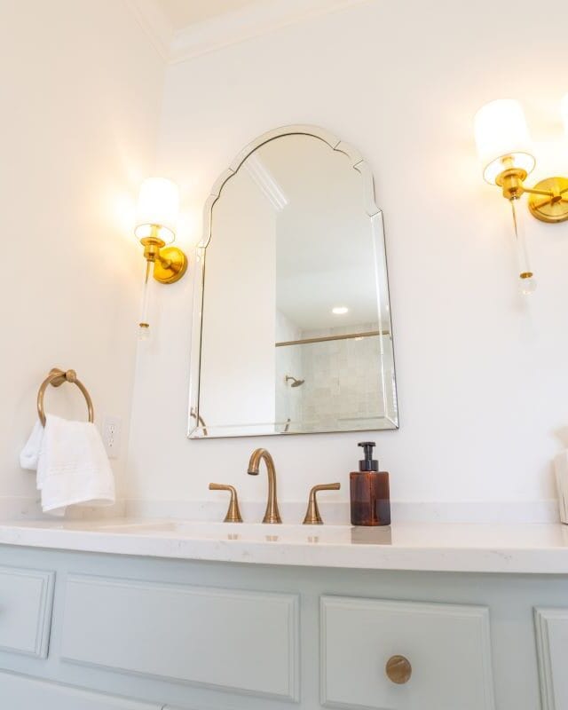 Highland Lakes bathroom transformation with modern fixtures and elegant lighting.