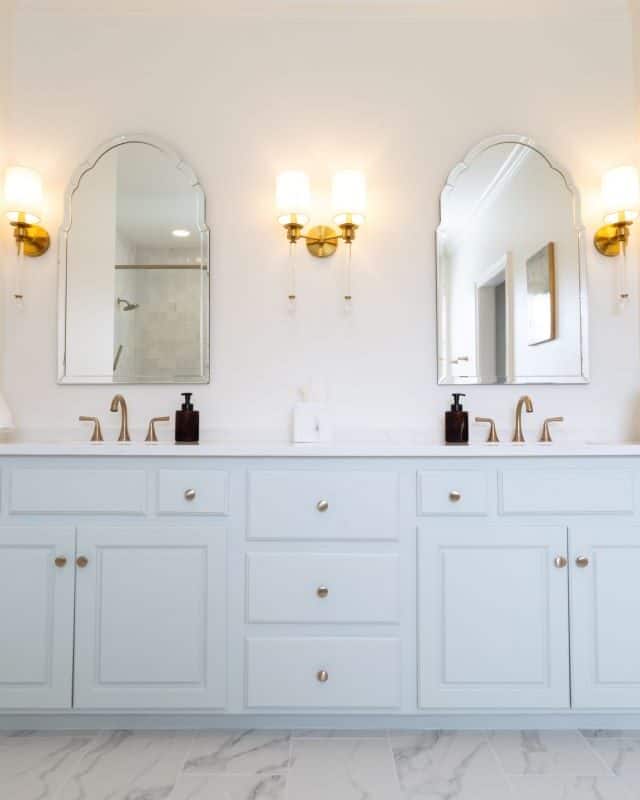 Elegant Highland Lakes bathroom vanity with dual mirrors and modern lighting.