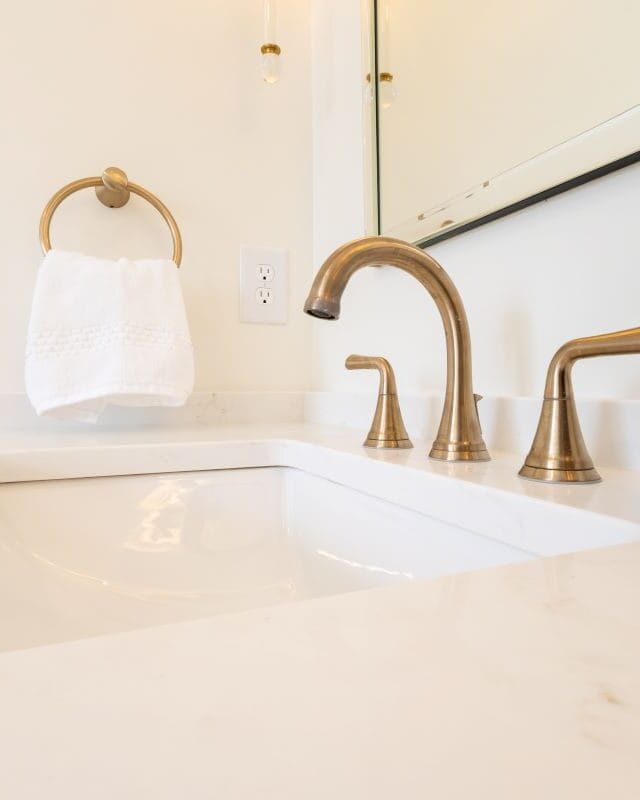 Highland Lakes bathroom vanity with modern faucet and accessories.