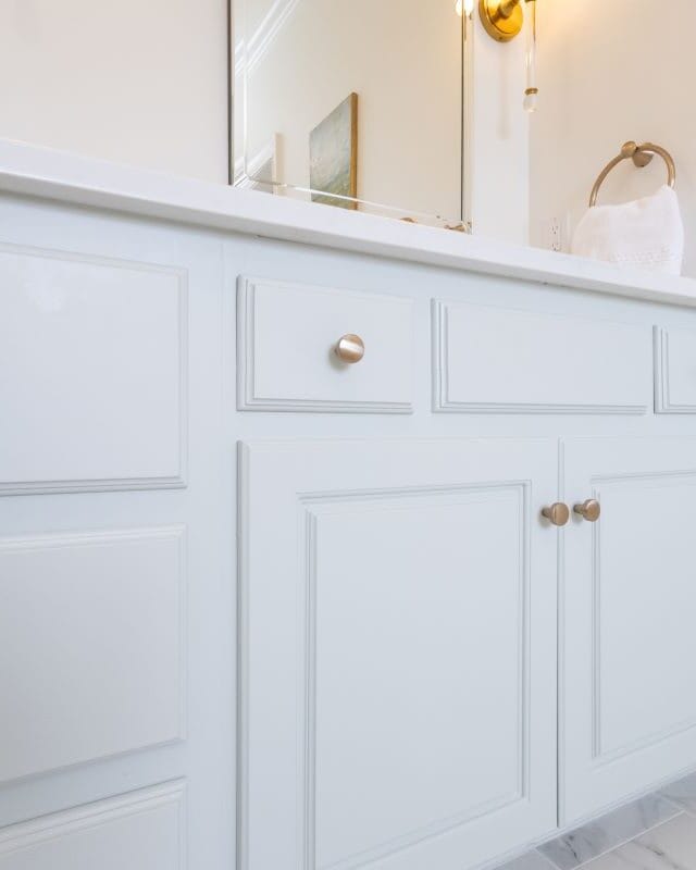 Highland Lakes bathroom vanity with white cabinetry and modern hardware.